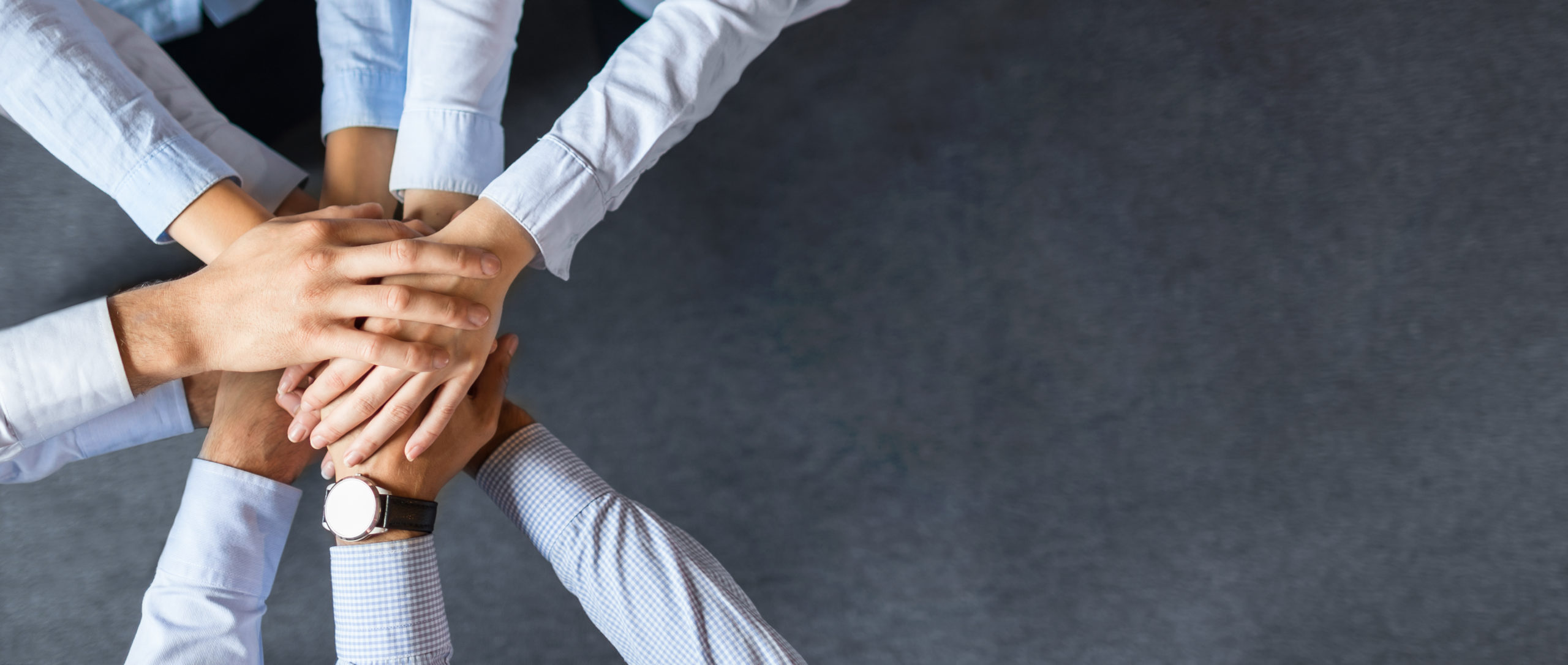 Close,Up,Top,View,Of,Young,Business,People,Putting,Their
