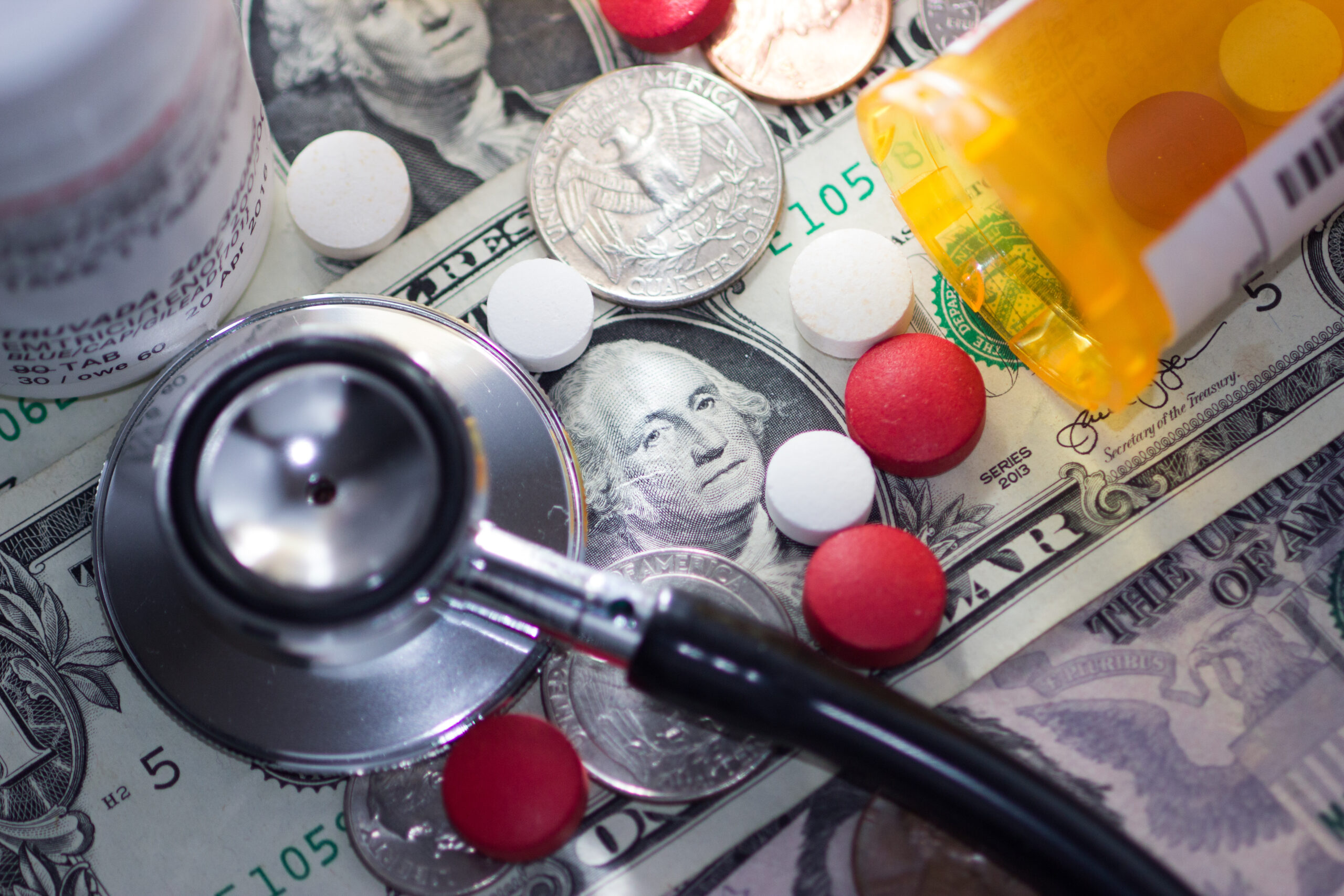 Health,Care,Costs,Symbolized,With,A,Dollar,Bill,,Pills,,Coins